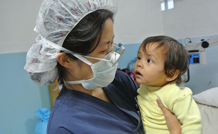 Dr. Nam looks at patient during Guatemala outreach