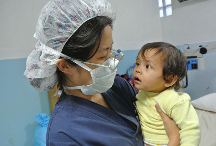 Dr. Nam looks at patient during Guatemala outreach