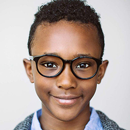 Young boy wearing glasses.