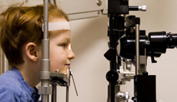 Child undergoing eye exam.